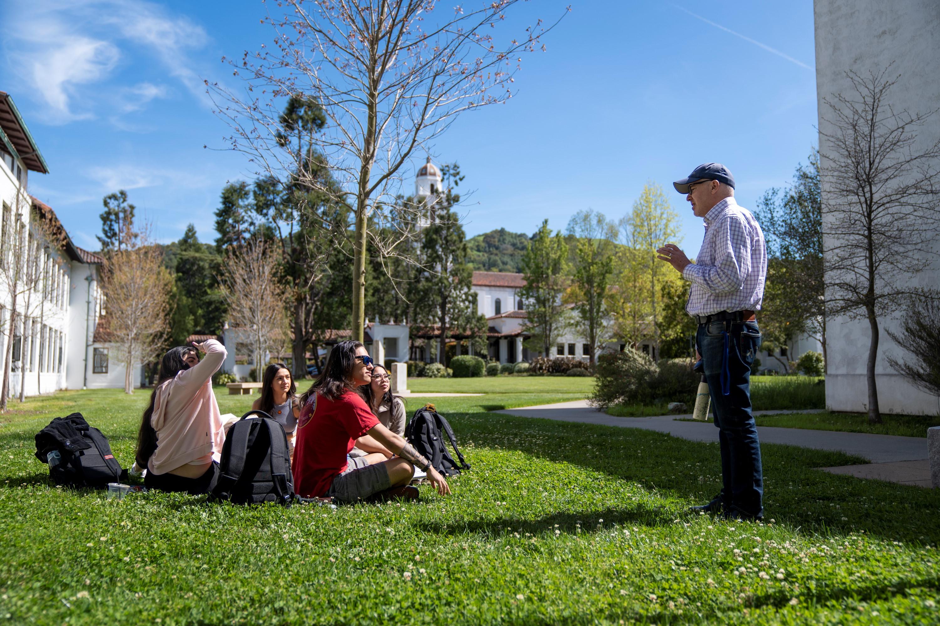 Students and faculty member outside