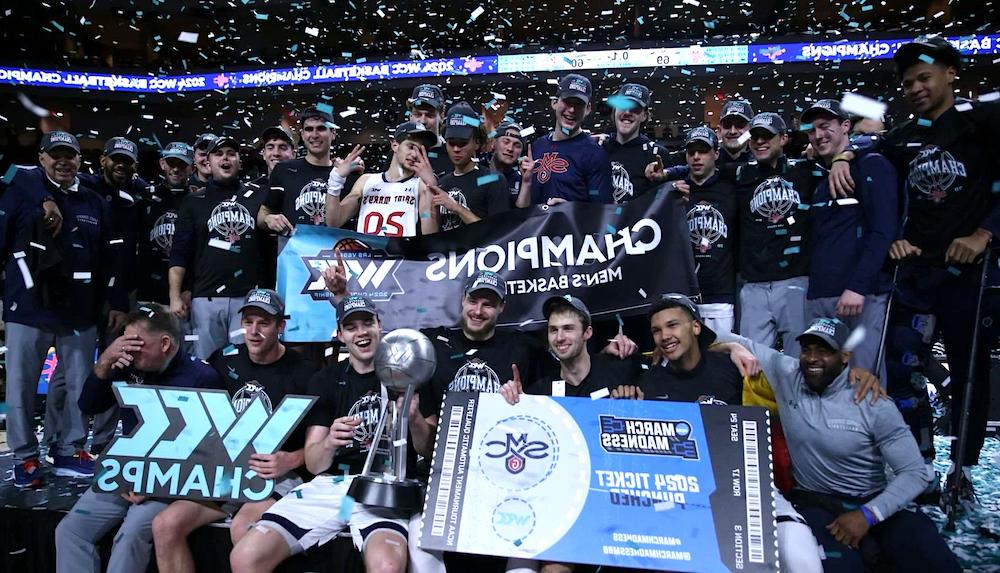 Men's 篮球 players celebrate WCC Tournament Championship victory in March 2024