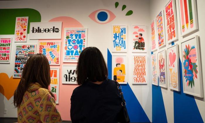 Visitors looking at exhibit of Lisa Congdon's "Hold It Lightly" at the SMC Museum of Art, October 2023