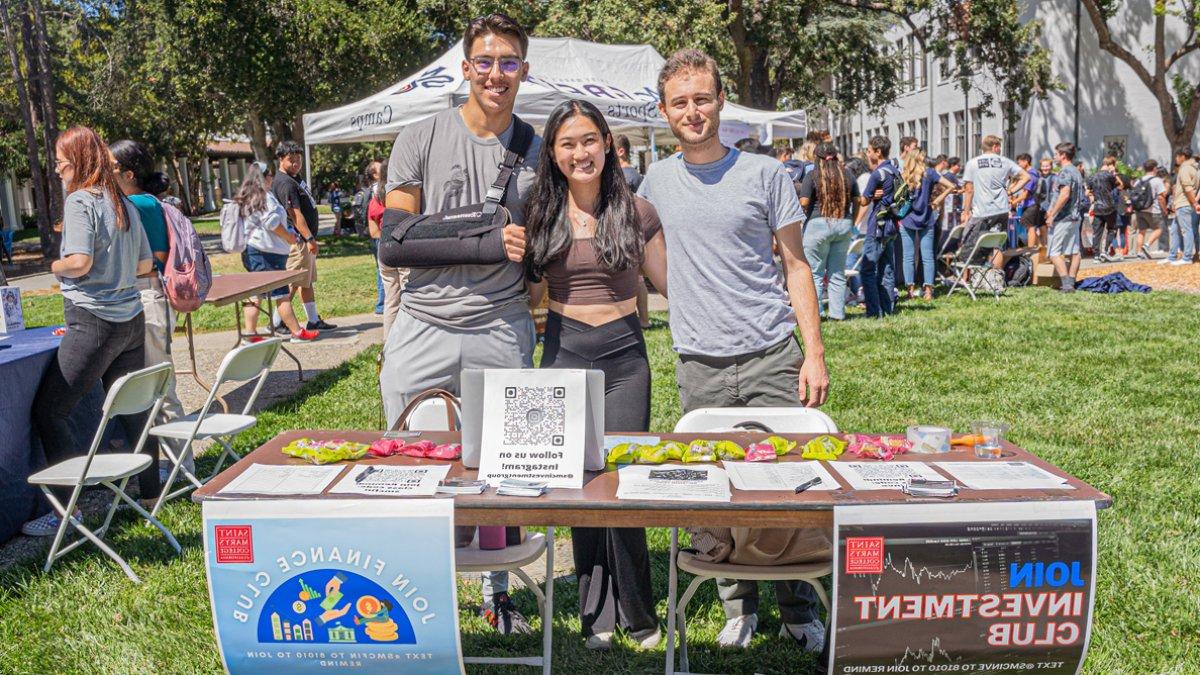 Students from the investment club and finance club standing together