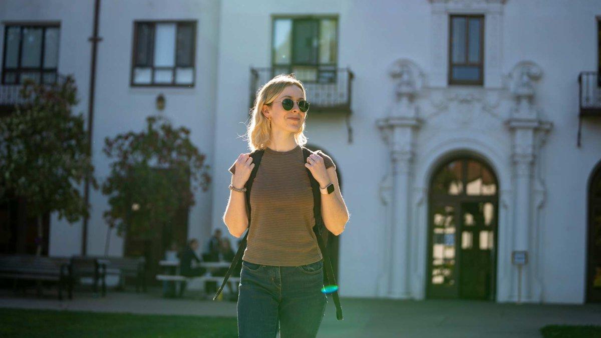 A student walking on campus 