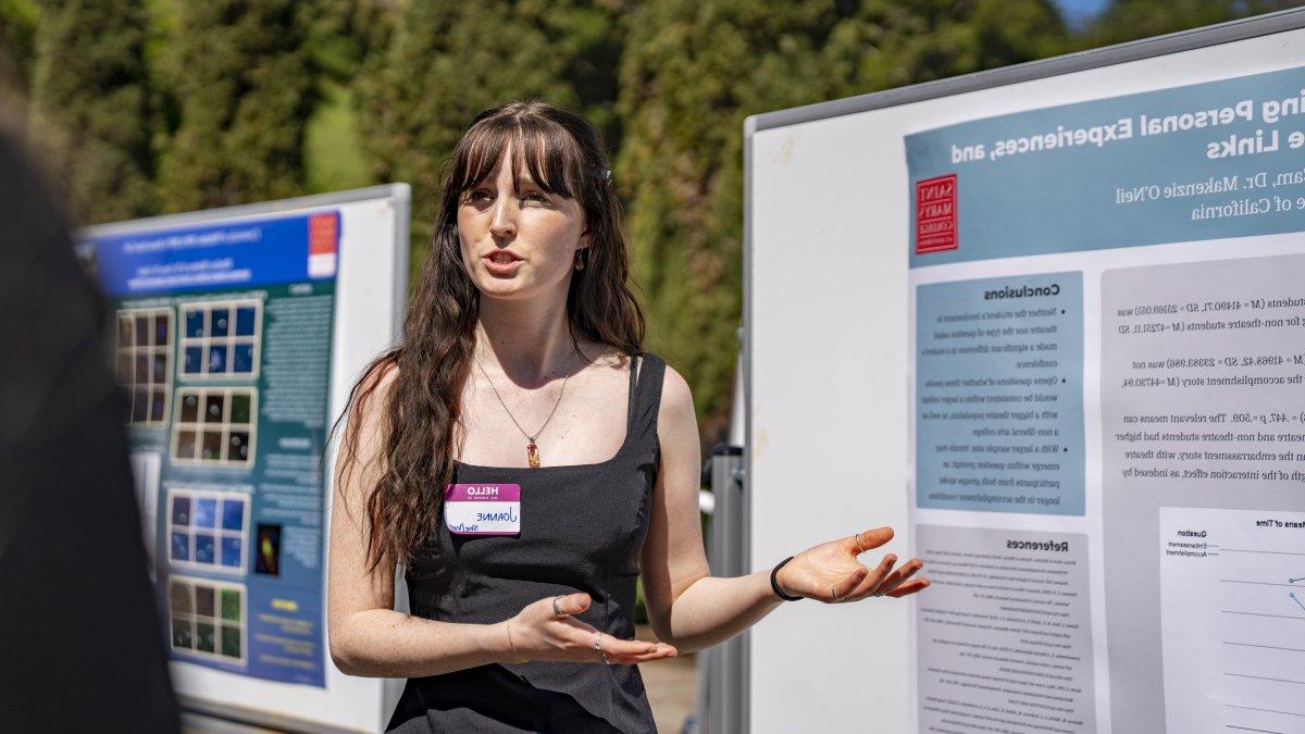 Student presenting research at a conference outside